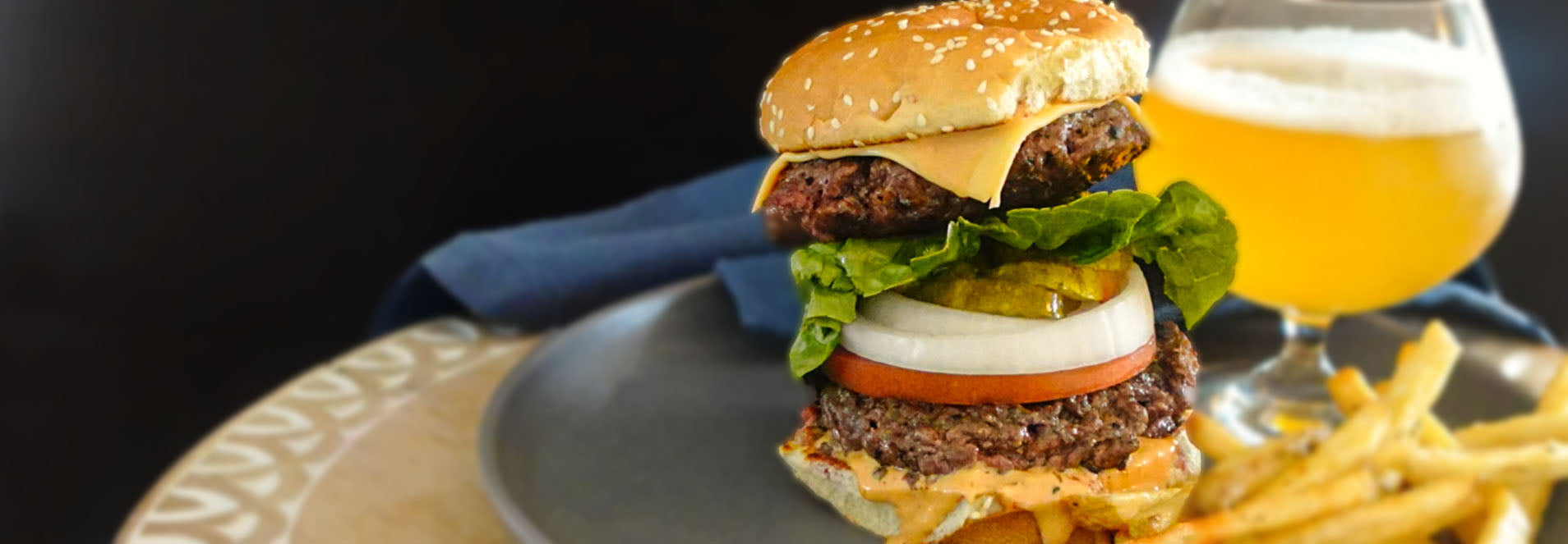 burger with a beer and french fries